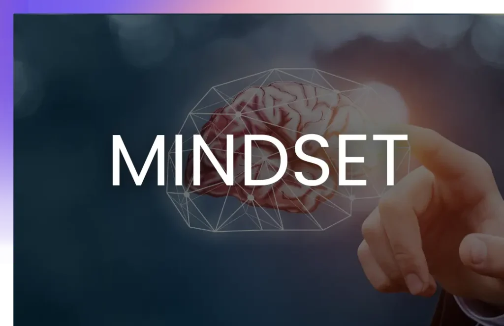 A hand pointing towards a digital illustration of a brain, overlaid with the word "MINDSET" in bold white letters.